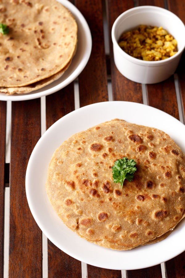 mooli paratha served on a white plate