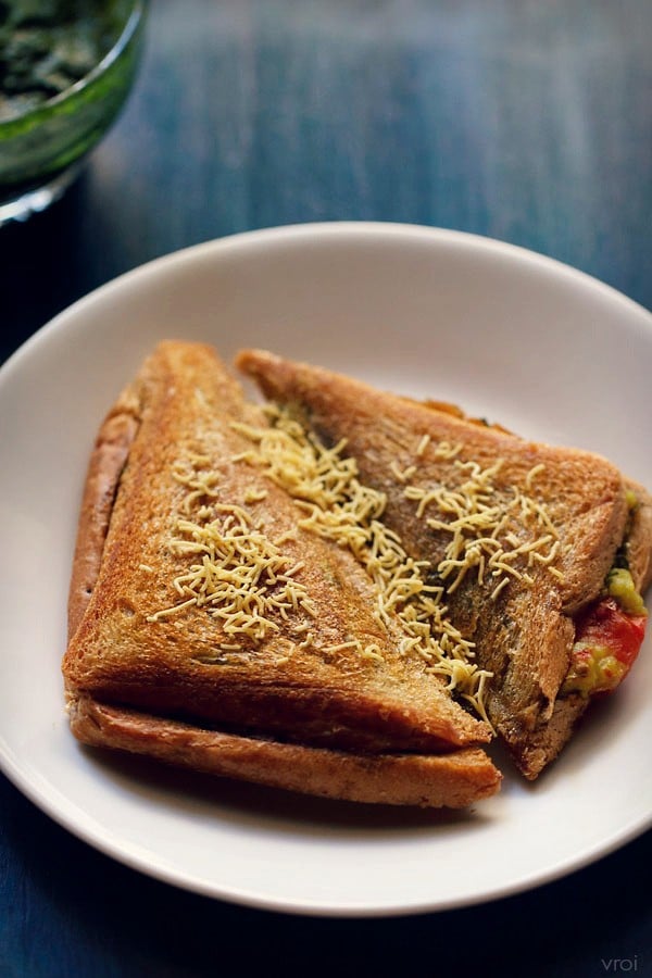 masala sandwich served in a white plate