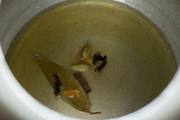 frying spices to make mint pulao recipe