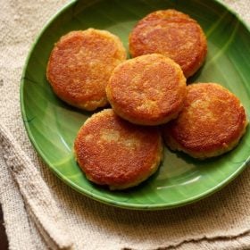 corn cutlet served on a green plate.