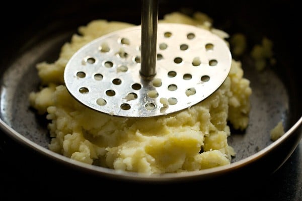 potatoes being mashed