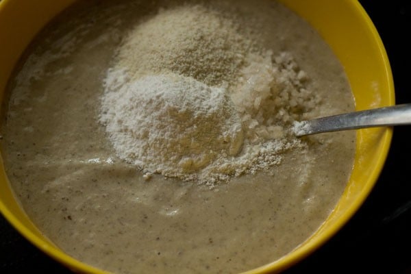 rice flour semolina and salt added to lentil batter in bowl