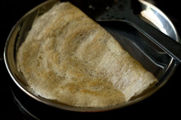 cooked mixed dal dosa on a plate