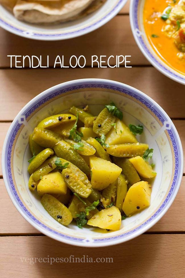 top shot of aloo tendli bhaji garnished with chopped coriander leaves and served in a designer ceramic bowl with text layovers. 