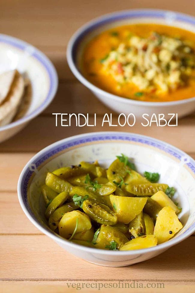 aloo tendli bhaji garnished with chopped coriander leaves and served in a designer ceramic bowl with text layovers. 