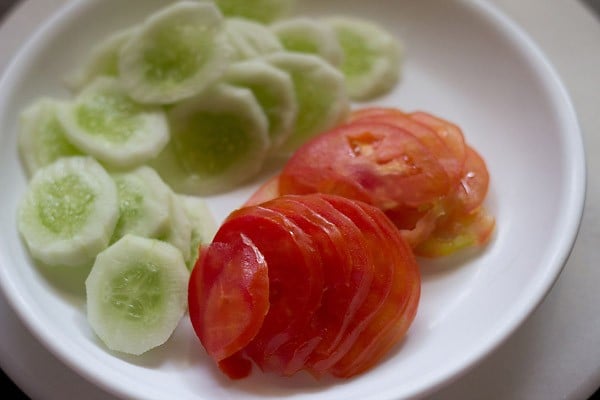 sliced tomato and cucumber on a plate