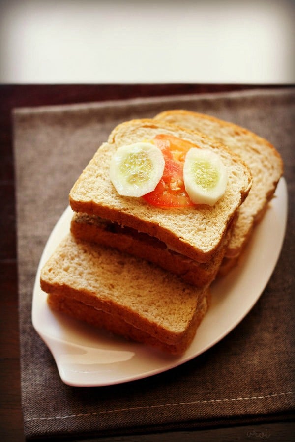 tomato cucumber sandwich served on a plate