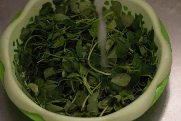 rinse methi or fenugreek leaves very well in running water