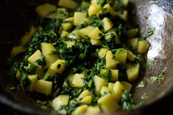 sautéing aloo methi sabji