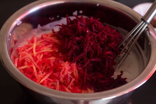 beetroots and carrots in bowl with the curd 