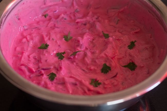 beetroot raita garnished with some coriander leaves