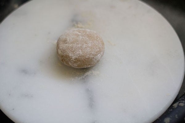 dough dusted with flour on a rolling board