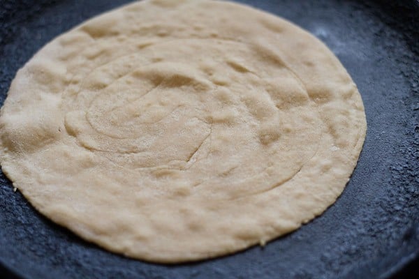 lachha paratha placed on tawa