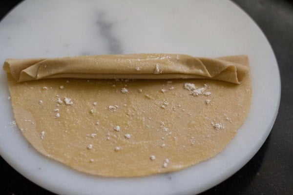 start folding and pleating paratha dough
