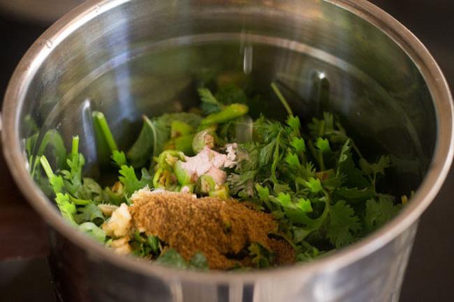 ground cumin and salt on the remaining chutney ingredients in blender