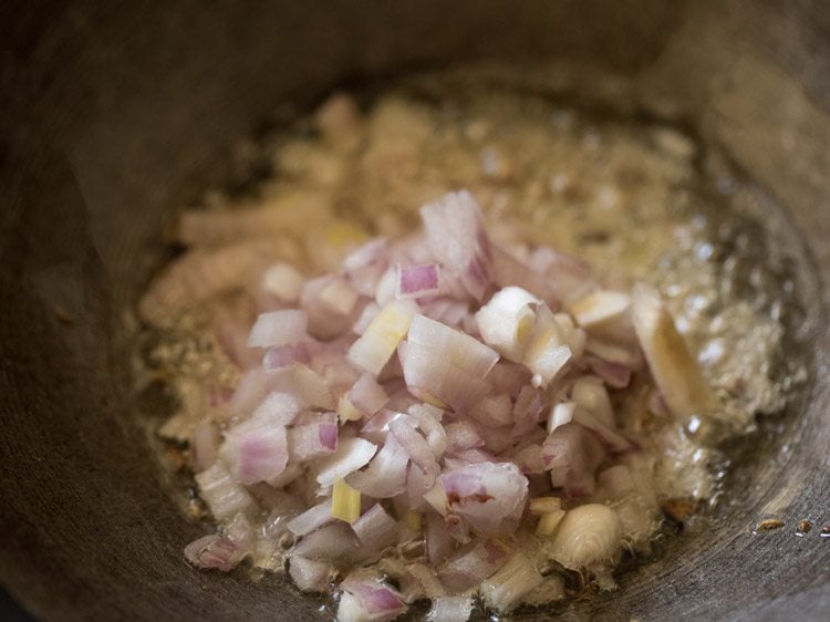 chopped onions added to the kadai