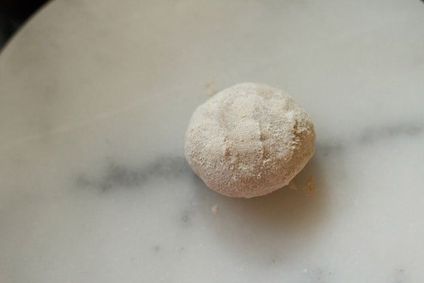 paratha dough ball on a board