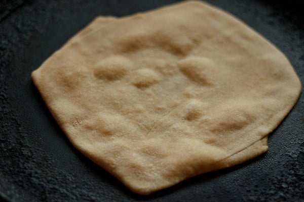 frying paratha on skillet