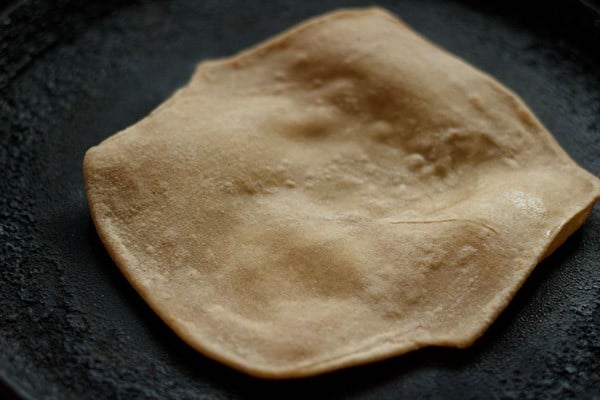 frying paratha on skillet