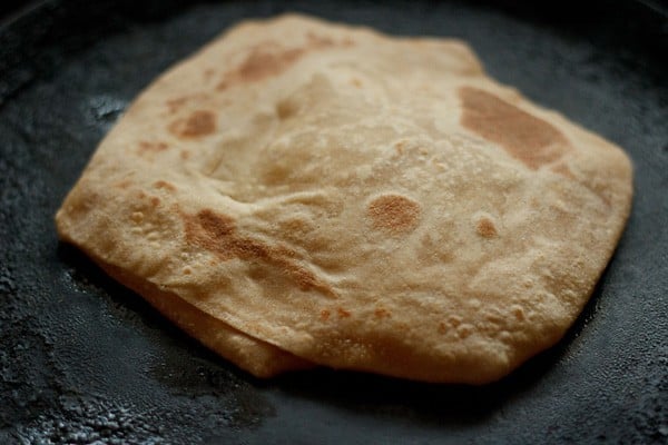 frying paratha on skillet