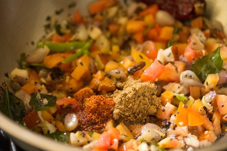 adding spices - turmeric powder, red chili powder, coriander powder, garam masala powder 