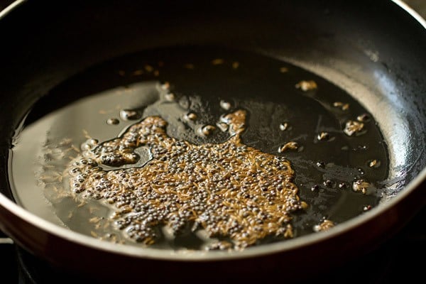 sautéing cumin seeds.