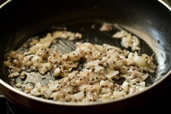 sautéing onions for batata poha.