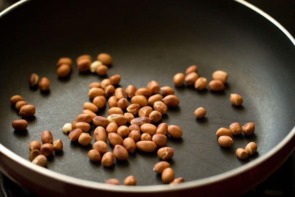 roasting peanuts for aloo poha.
