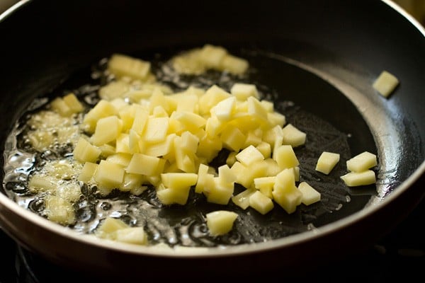 chopped potato added to pan.