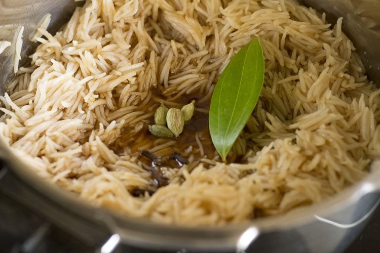 cardamom cloves and tej patta added to rice