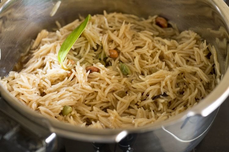 mixing raisins with jaggery rice