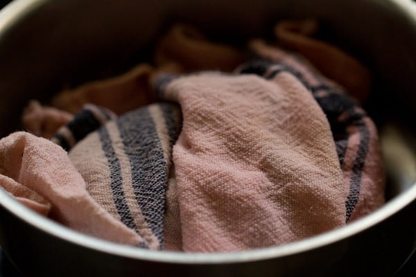 puri dough covered with cloth