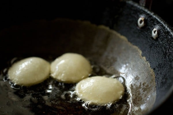 frying puri pieces in oil