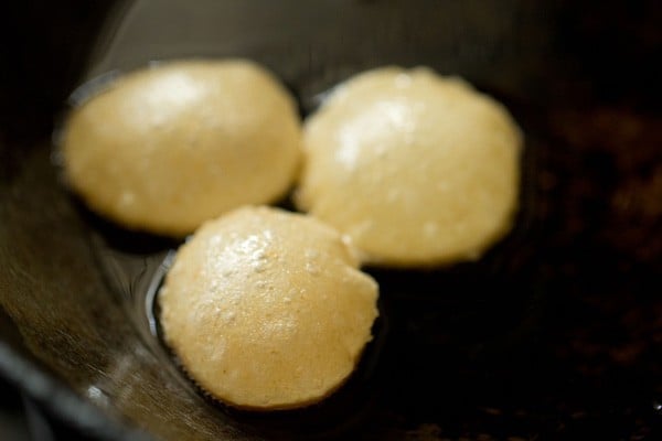 fried puri taken out from kadai