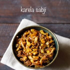 karela sabji served in a bowl with text layover.