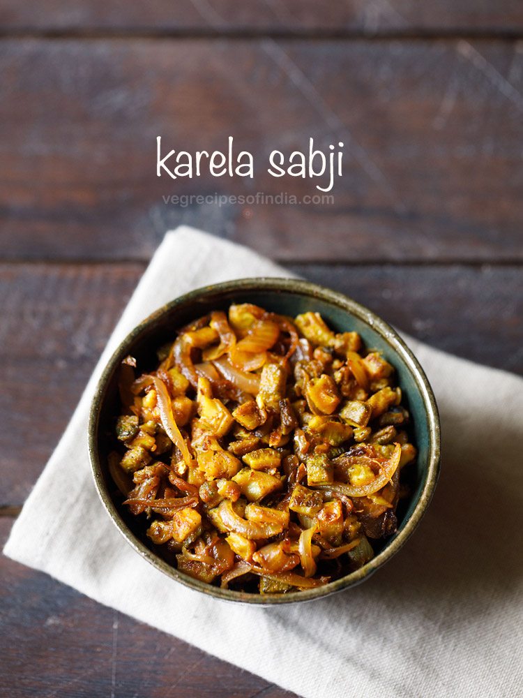 karela sabji served in a bowl with text layover.