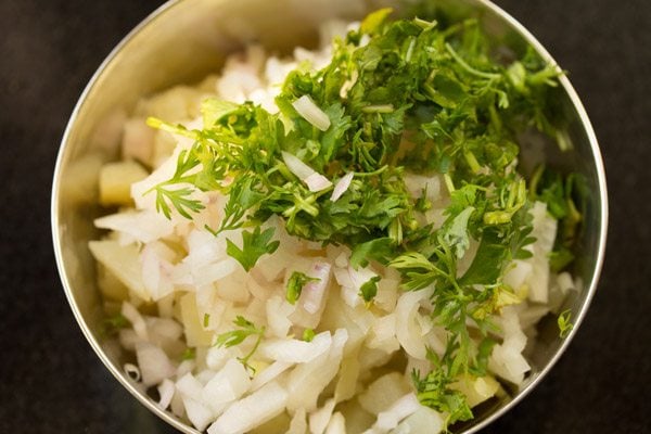 coriander leaves added to potatoes