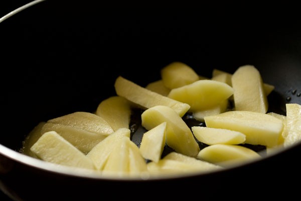 potato wedges added to pan