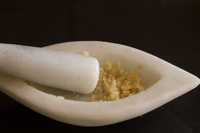 ginger garlic paste in a mortar pestle