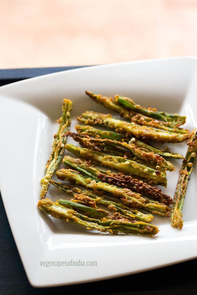 kurkuri bhindi fry served on a white plate. 