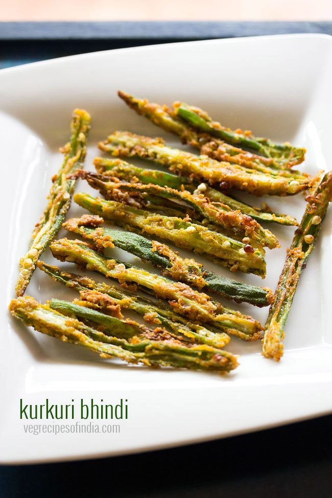 bhindi fry or kurkuri bhindi served on a white plate.