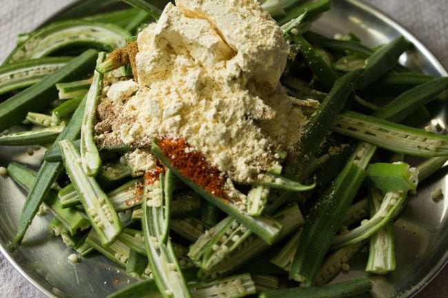 gram flour added to the sliced bhindi. 