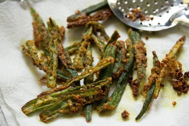 prepared kurkuri bhindi fry on a paper kitchen towel. 