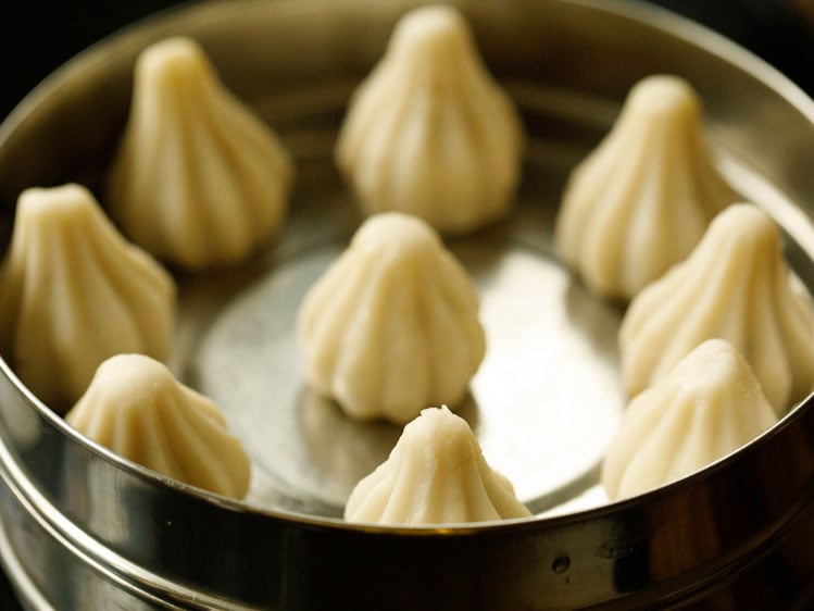 modak placed in a greased pan