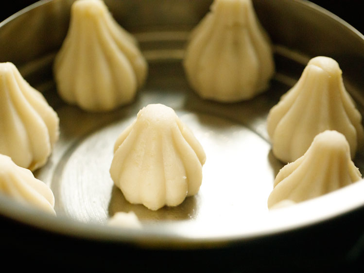 modak pans placed in the pot for steaming