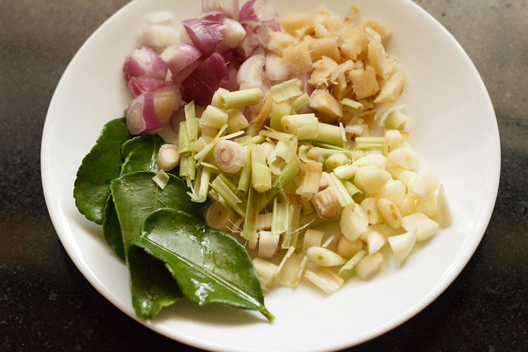 herbs in a plate to Thai red curry paste