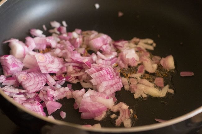 chopped onion added to the pan. 