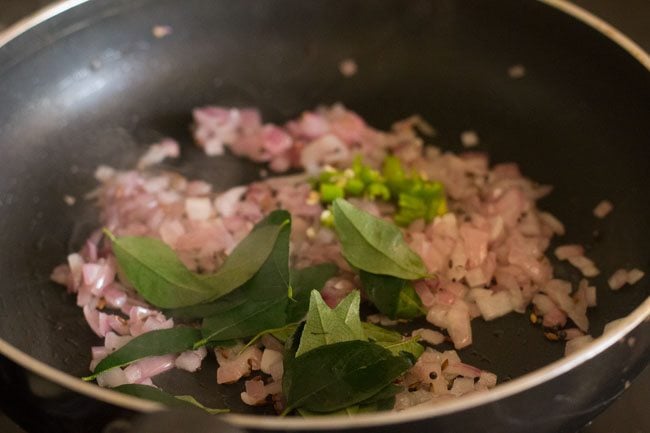 curry leaves and chopped green chili added to the pan. 