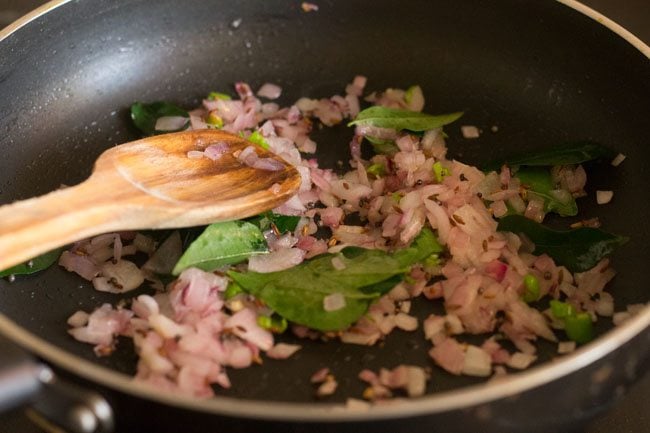 frying the onion mixture in the pan. 