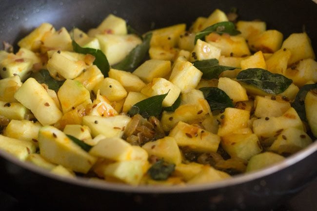 sautéing ash gourd in the pan. 